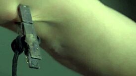 Anally Hooked Slut Endures Brutal Whipping in BDSM Scene.