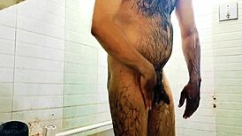 Gay sex video with an Indian hunk with a big cock in a bathroom
