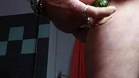 granny shocks by banging hairy pussy with cucumber in kitchen.