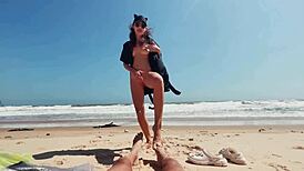 Teen brunette masturbates publicly on nude beach, caressing feet while guy jerks off and cums