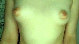 girlfriend slobbering on big tits and playing with nipples at home