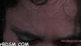 the cheerful brunette slave plays with her rubber toy, exploring bdsm fantasies in a hardcore session.