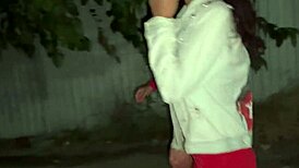 Two teen girls pissing openly by the car