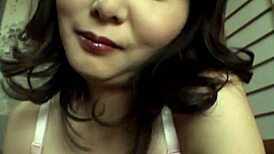 Hot japanese brunette gives natural tits handjob closeup 😍