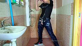 Gay guy jerks off in shower with jeans fetish.