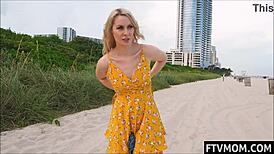 Hot milf flashes nude body on public beach without shame.