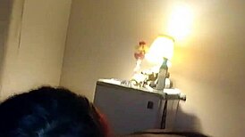 Redhead gives deepthroat blowjob in casual setting.