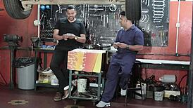 Mechanic Working On Bodybuilder's Muscular Body