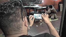 Mechanic Working On Bodybuilder's Muscular Body