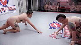Nikki Sequoia battles Shelby Paris in rough lesbian wrestling. Strapon fucks the loser in wild action.