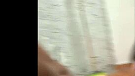 A gay man is getting some head from his partner in a private setting