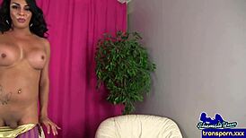 Tattooed trans mature strokes her fat dick solo