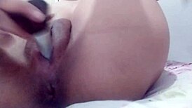 close-up of teen babe masturbating her shaved pussy to orgasm