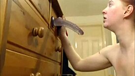 She practices sucking cock with a dildo, improving skills