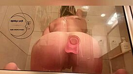 Her pussy drips after intense anal play in the steamy shower.