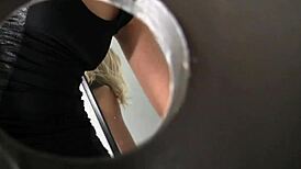 in the gloryhole, the sexy blonde sucks a big black cock until cumshot