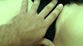 Teasing the redhead's pink pussy with gentle caresses.