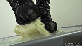 Asian babe stomps noodles in shoes for foot fetish excitement.