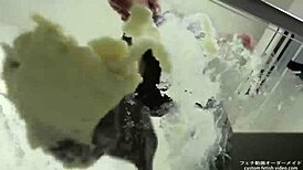 Asian babe stomps noodles in shoes for foot fetish excitement.