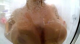 Nikki Benz soaps up her big tits while masturbating 😏