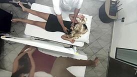 Real video of masseur having sex with woman next to her husband.