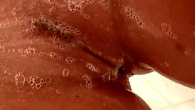 Nikki Benz soaps up her big tits while masturbating 😏