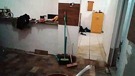 Blonde milf cook Stella Still shows off her big tits in the kitchen wearing red.