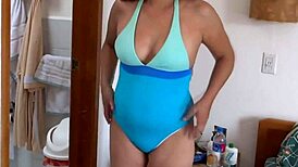 dude, this 59-year-old mature beauty rocks a bikini on the beach, her big assets are unreal in this compilation