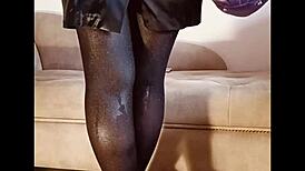 Shiny pantyhose pee in toilet with heels and feet.