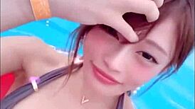 watch japanese babe with big boobs in a sexy pool dance