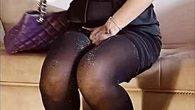 Shiny pantyhose pee in toilet with heels and feet.