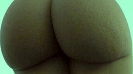 this hot black chick is showing off her massive ass on camera, teasing with her curvy body.