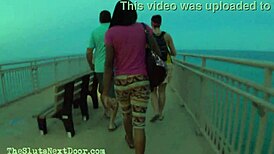 two brunettes giving double handjob on public beach fun