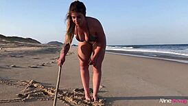 Blonde girl gets wild on the beach banging her fan