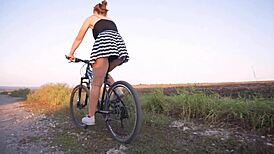 Secret camera captures a woman showing her thong while she is on her bike