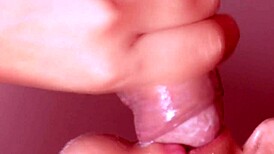 This Japanese wife is cheating with a monster cock in a close-up blowjob scene.