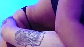 Young 18-year-old brunette with natural small tits and tattoos rides cock intensely.