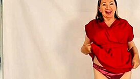 hot granny flaunts huge natural tits while stripping down. closeup reveals tight asshole and wet pussy!