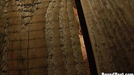 Voyeur watches lesbian slave in bondage. She fingers her big ass and tits, orgasming hard.