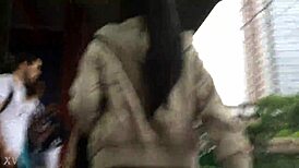 Jacket and boots candidly exposed on the train street scene.