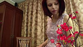 This redhead cutie in white stockings slowly strips her clothes for a tease