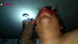 in this scene, a latina milf prostitute in lingerie and high heels gives a footjob with her fishnet clad feet