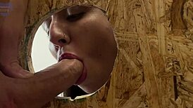 Slut through gloryhole gets cumshots in mouth and pussy