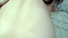 Amateur video with a young woman in an intimate setting.