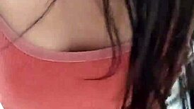 Amateur video with a young woman in an intimate setting.