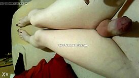 damn, check this shemale spilling cum on legs and feet!