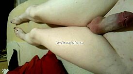 damn, check this shemale spilling cum on legs and feet!