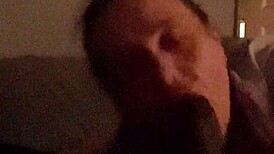 going wild sucking this beautiful big black cock in the bedroom.