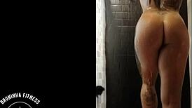 the redhead cowgirl shaves her pussy in the shower, making it smooth and wet