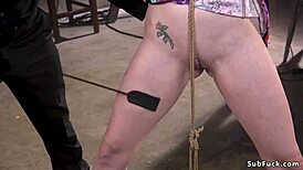 pale slave girl tied up and taking a huge cock in bondage